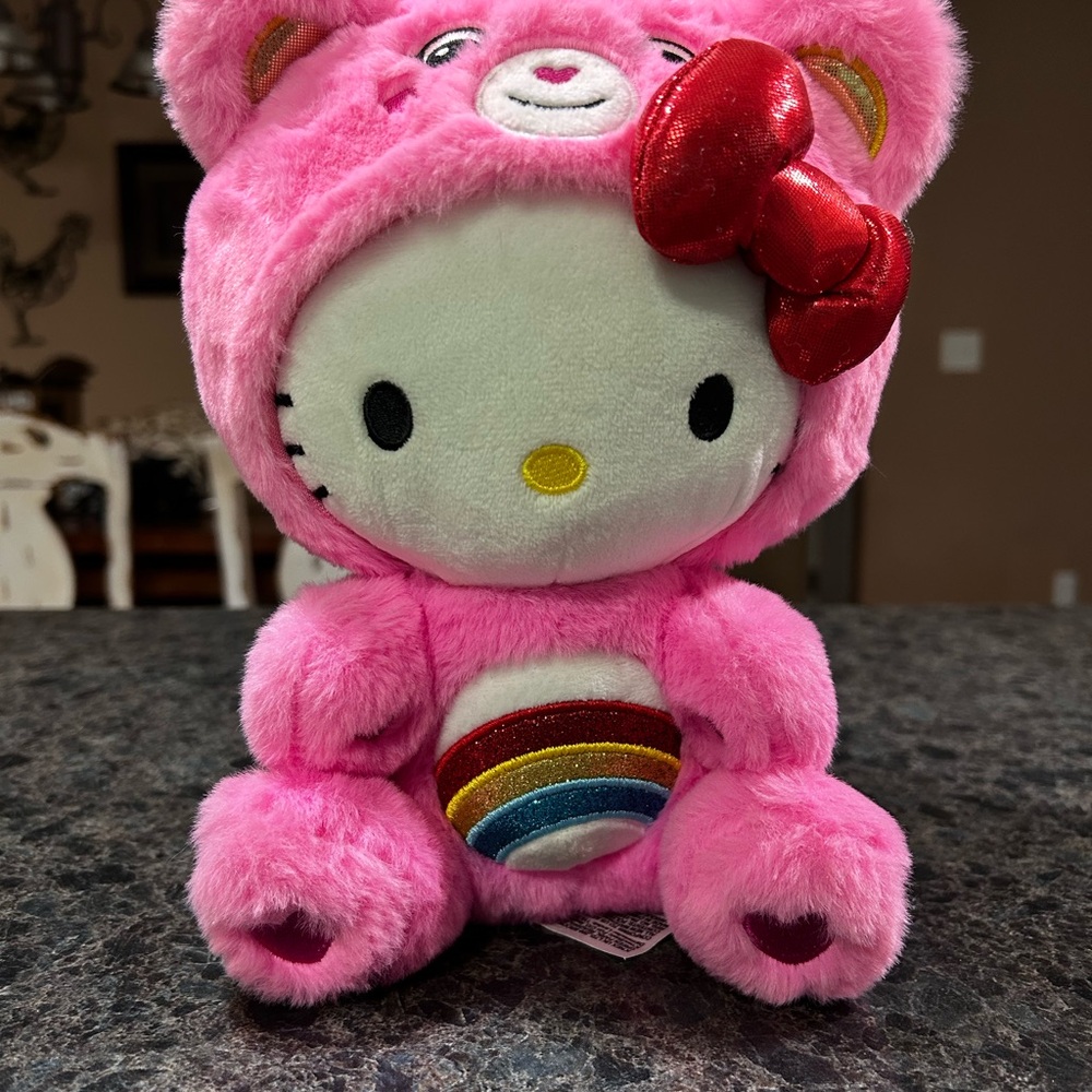 Hello Kitty Pink Plush dressed as a Care Bear with Rainbow Belly